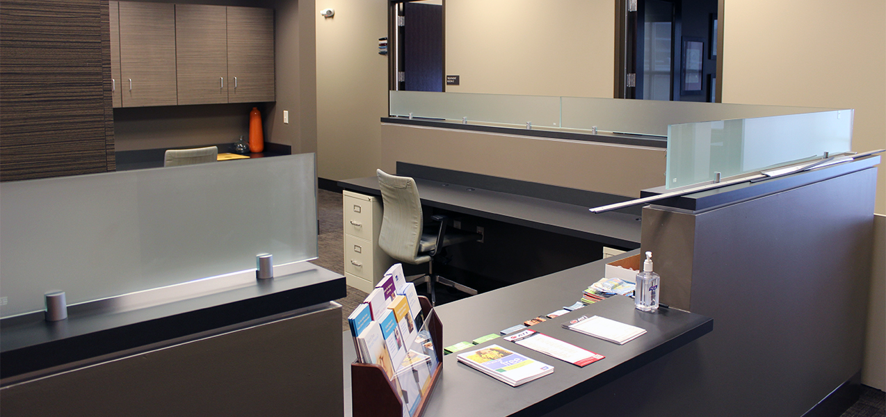 Remodeled reception desk by Tri-North Builders for Advent health care services in Mequon, Wisconsin.