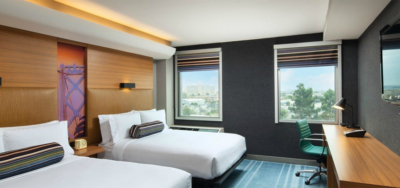 Room with two beds inside the Aloft San Fran, remodeled by Tri-North Builders.