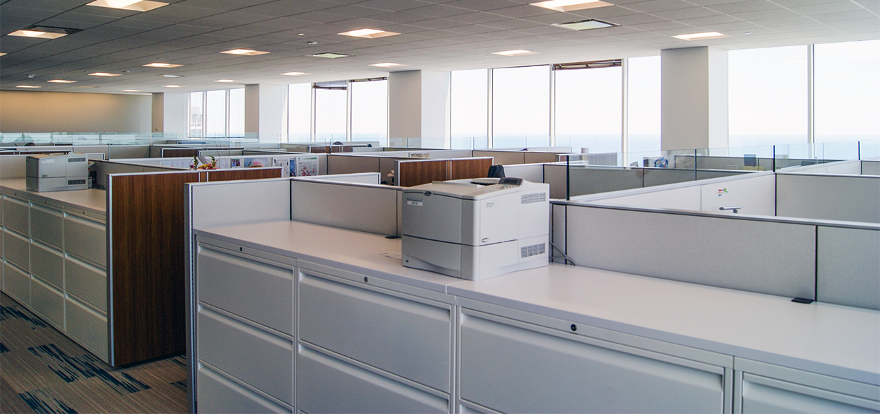 Office workspace and cubicles inside the CBRE building in downtown Milwaukee, WI, remodeled by Tri-North Builders.