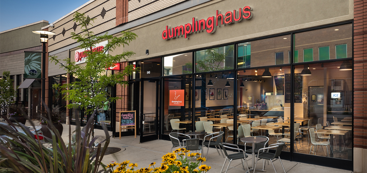 Front entrance and windows of Dumpling Haus restaurant including patio showcasing Tri-North Builder's work.