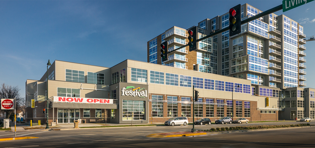 The Festival Foods grocery store is part of a large complex that also includes residences.