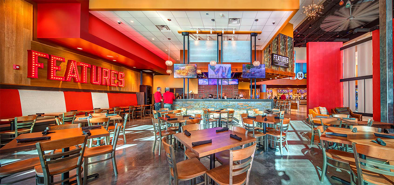 Dining tables and bar at GQT Riverview movie complex in Gibsonton, FL.