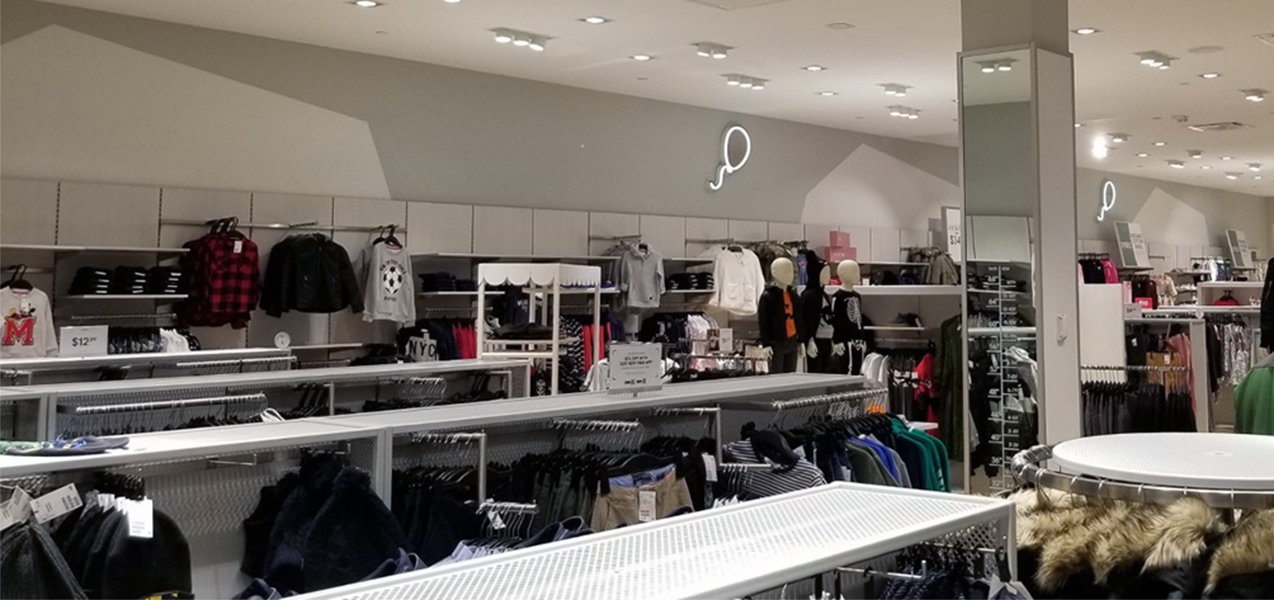 Winter clothing on racks at an H&M retail location, a Tri-North Builders project.