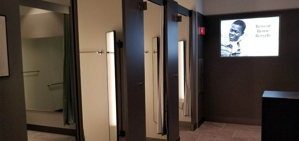 A row of dressing rooms in an H&M retail store constructed by Tri-North Builders.