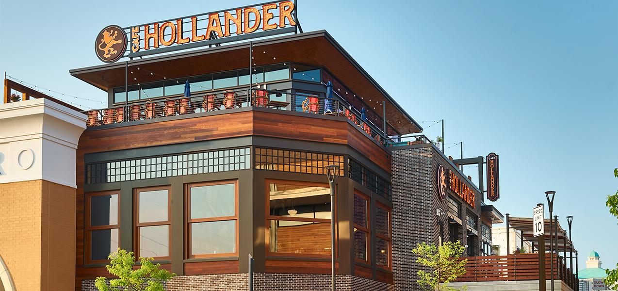 Tri-North builders Cafe Hollander project front windows and outdoor seating area.