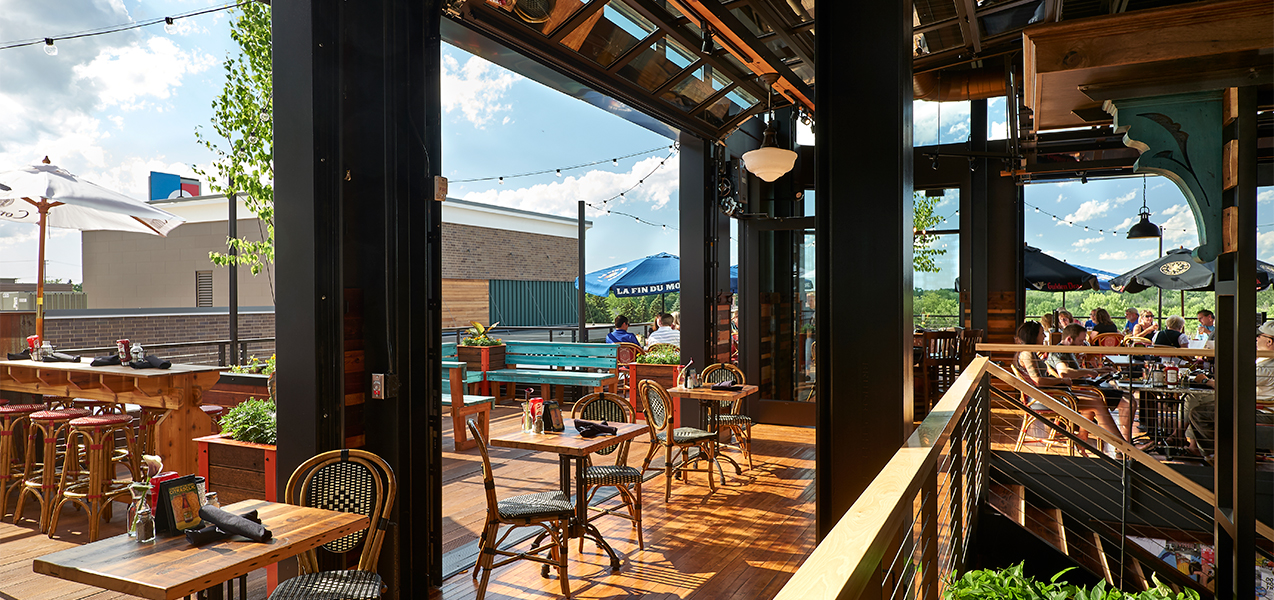 Outdoor seating, tables and deck for the Cafe Hollander Tri-North Builders project.