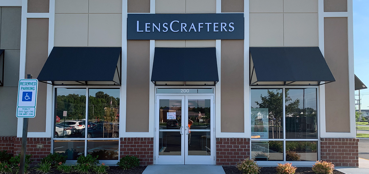 The LensCrafters sign is installed above the front entrance to this location, built by Tri-North.