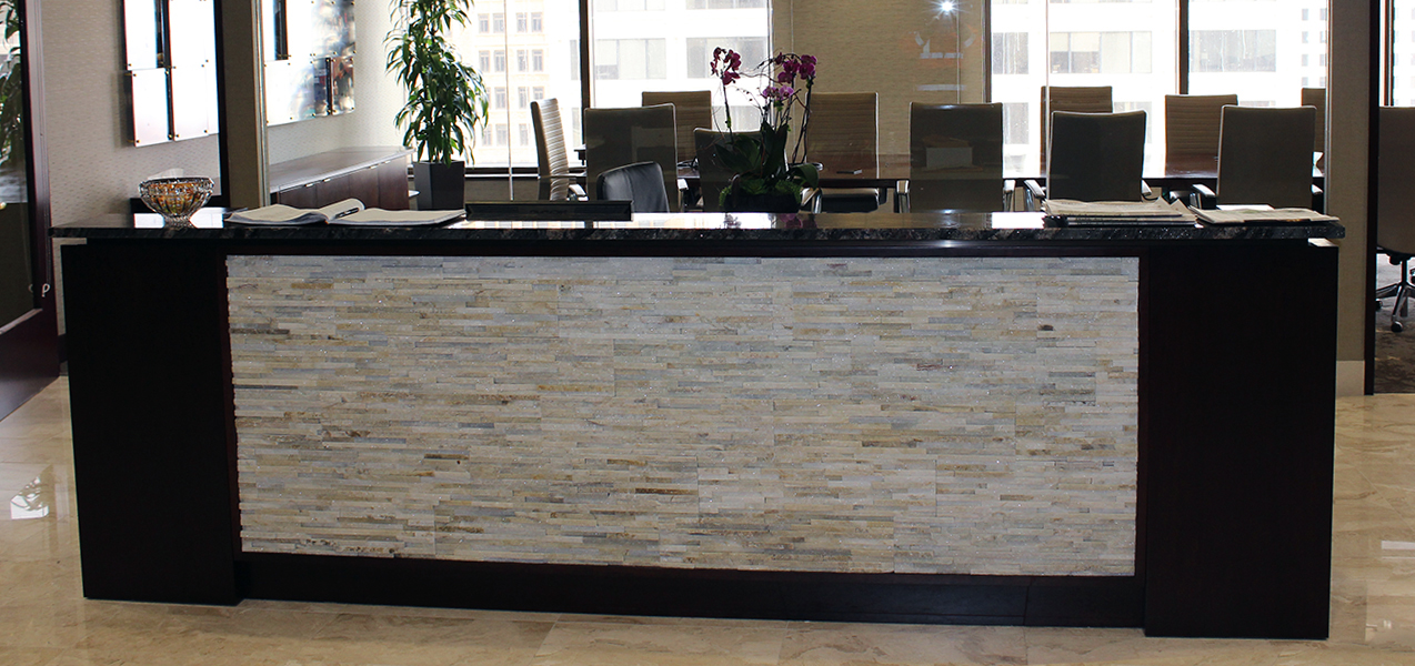 Receptionist desk in the remodeled Marcus Corp Headquarters by Tri-North Builders in Milwaukee, WI.