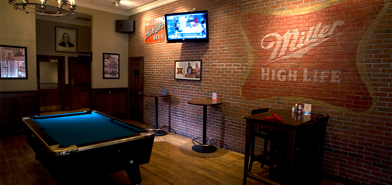 Pool table and game room built by Tri-North Builders inside the Miller Time Pub.