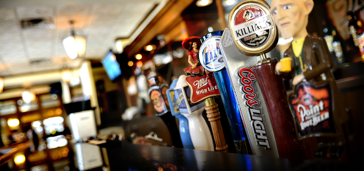 Close up of beer taps inside the Miller Time Pub bar in Wisconsin. A Tri-North Builders project.