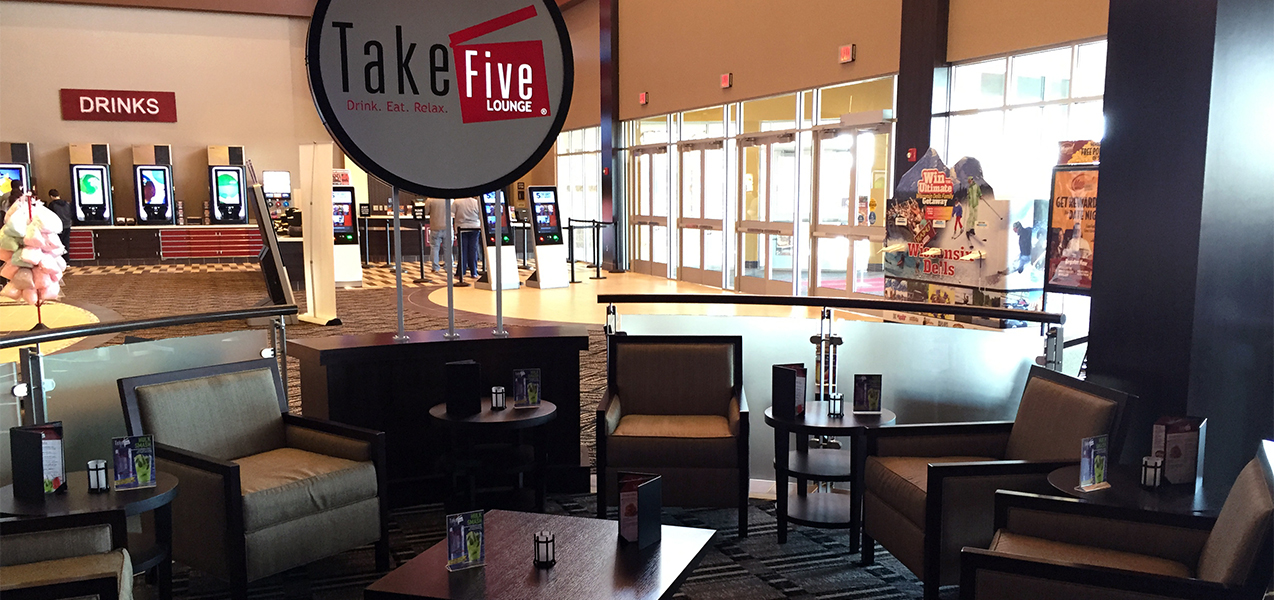 Take Five Lounge sign, seating area, facing front door of the Palace Cinema movie theater.