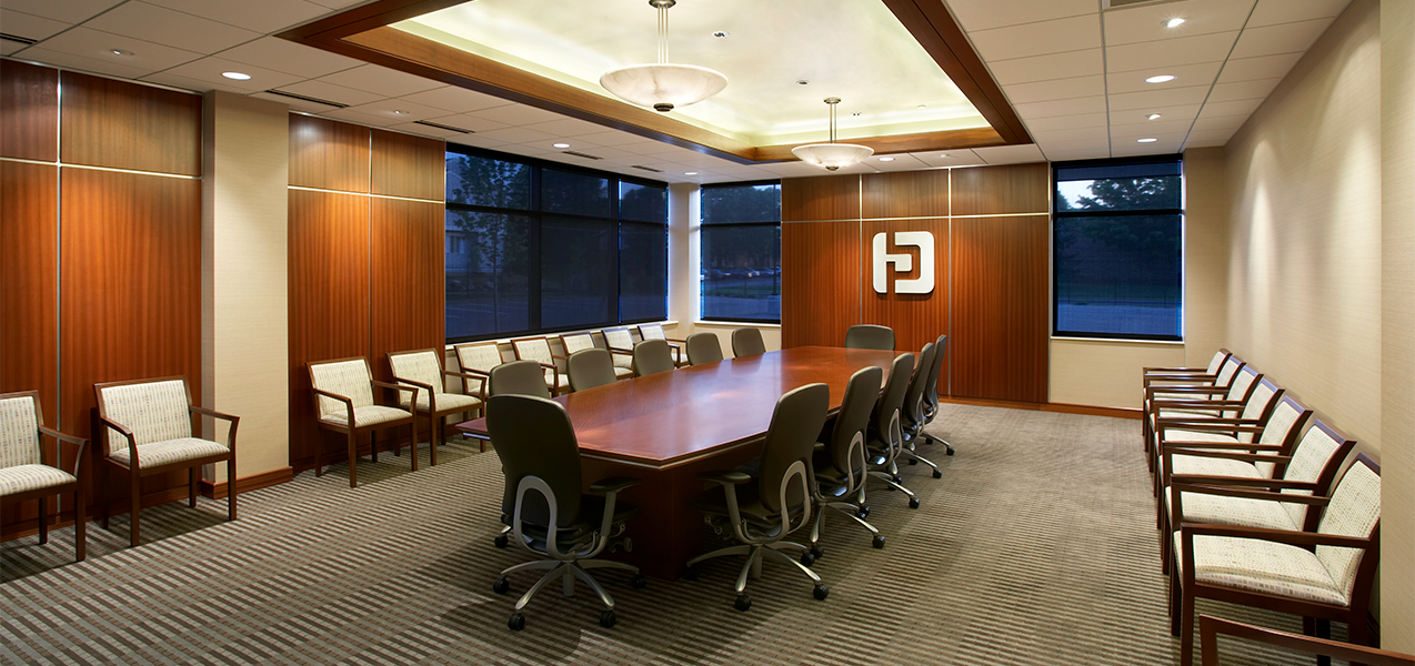 Large conference room with table and chairs in the Tri-North Builders remodel project for Park Bank Corporate Headquarters.