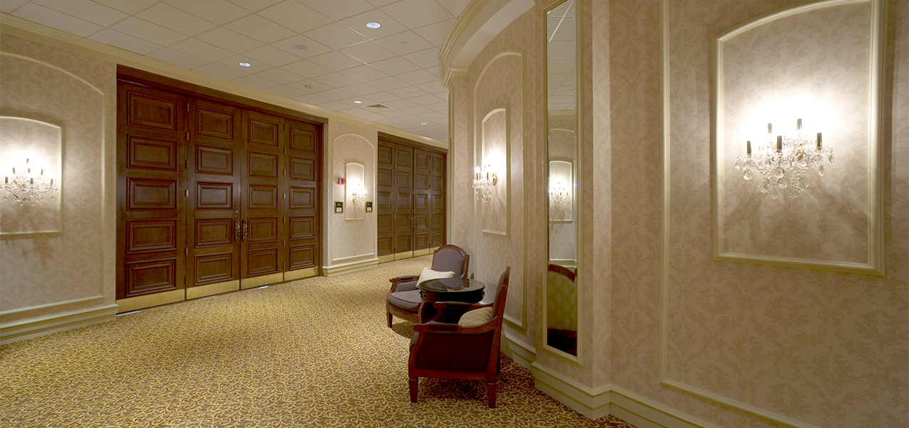 Hallway with chairs and door remodel project by Tri-North Builders at the Pfister luxury hotel in downtown Milwaukee, WI.
