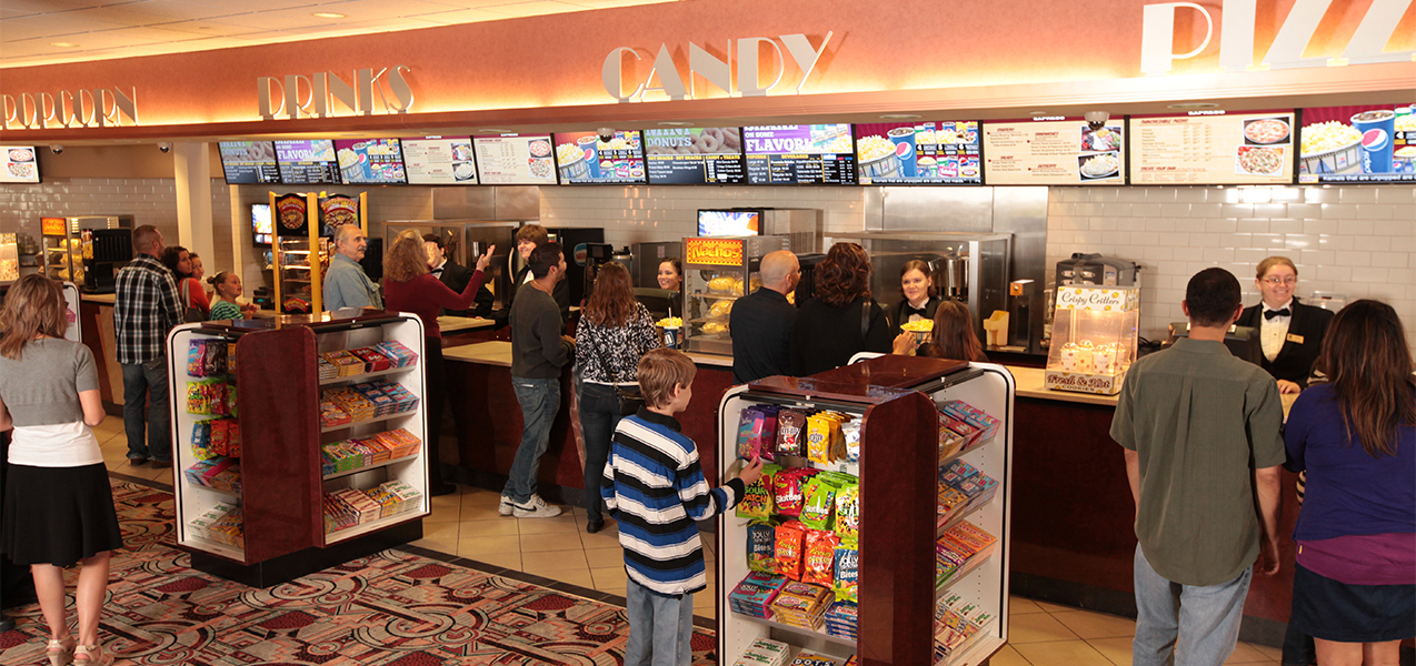 Concession stand and customers at the Marcus Point Cinema movie theater, a construction project of Tri-North Builders in Wisconsin