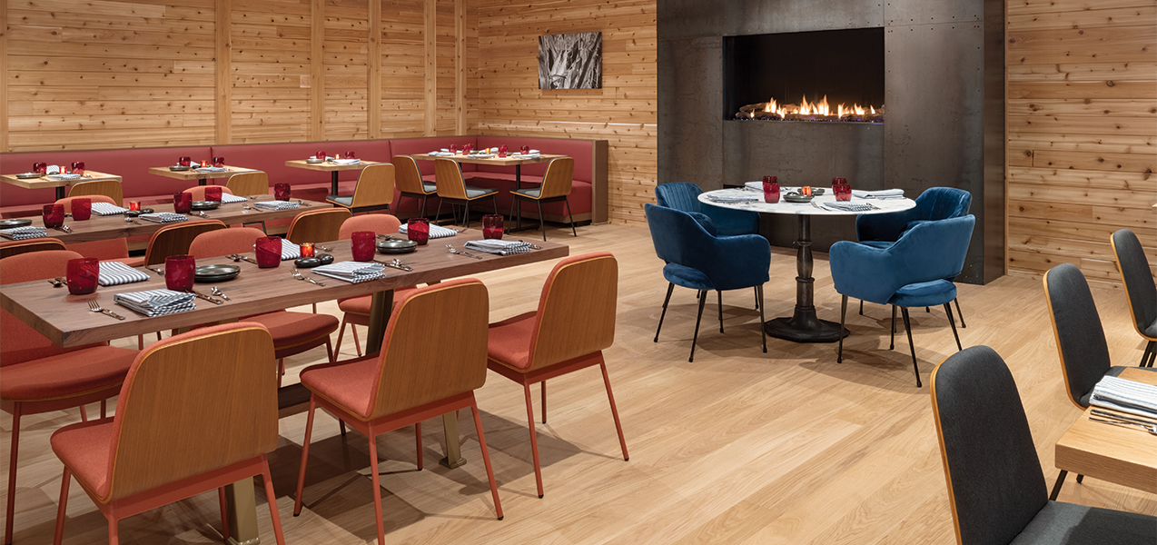 Dining area and fireplace in the Tri-North remodeled Radisson Hotel & Conference Center Green Bay.
