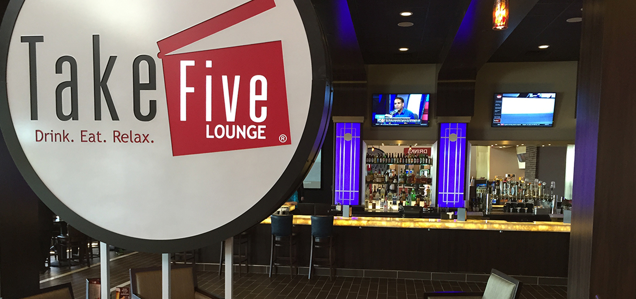 Bar and sign inside the Take Five Lounge in Madison, WI, as built by Tri-North Builders.