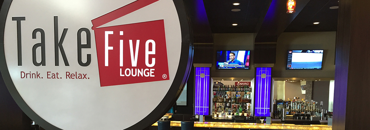 Bar and sign inside the Take Five Loung in Madison, WI, as built by Tri-North Builders.