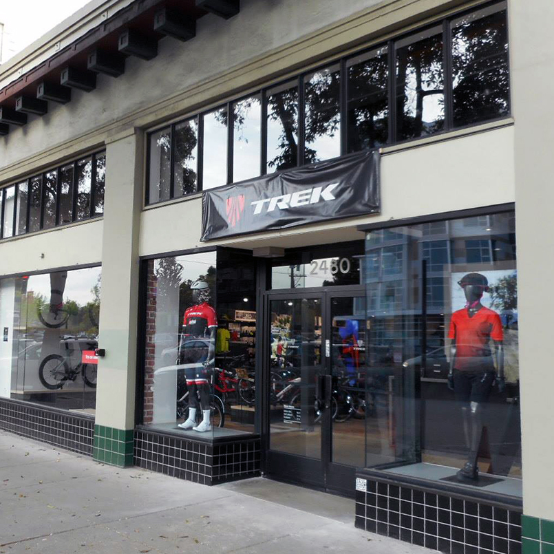 Mannequins stand in the windows at the entrance to a Trek bike store built by Tri-North.
