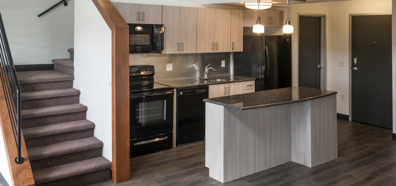 Tri-North Builders remodeled kitchen area inside an apartment at the Treysta on the Water Apartments in Monona, WI.