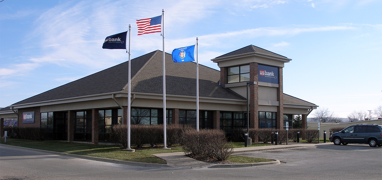 Flags flying over the US Bank building which is a Tri-North Builders project in Wisconsin.