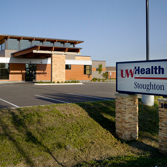 Sign and front entrance of the Tri-North Builders project at the UW Health Stoughton Clinic in Stoughton, WI.