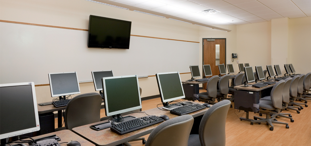Classroom with computers and tables inside the Madison Urban League building project by Tri-North Builders.