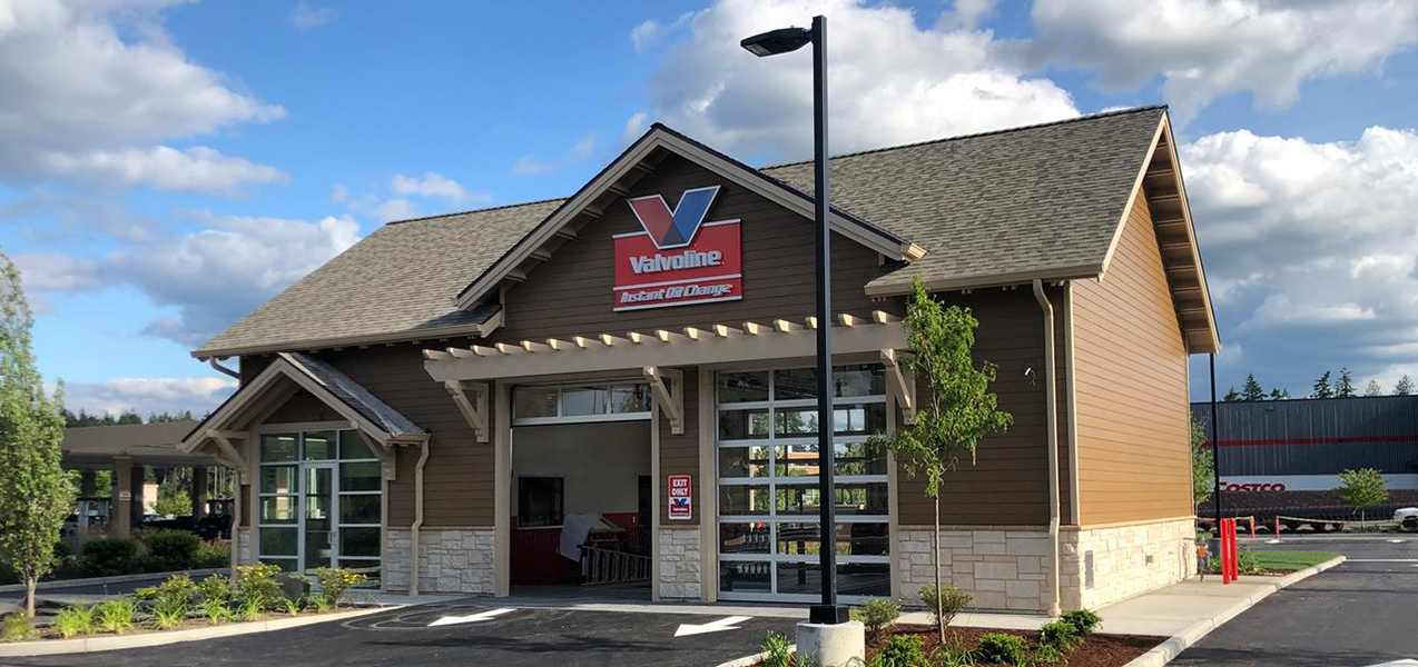 One bay door is open at a Valvoline Instant Oil Change location built by Tri-North builders.