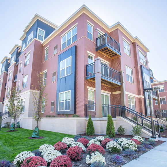 Remodeled building exterior of Veritas Village Apartments in Madison, WI, a Tri-North Builders project.