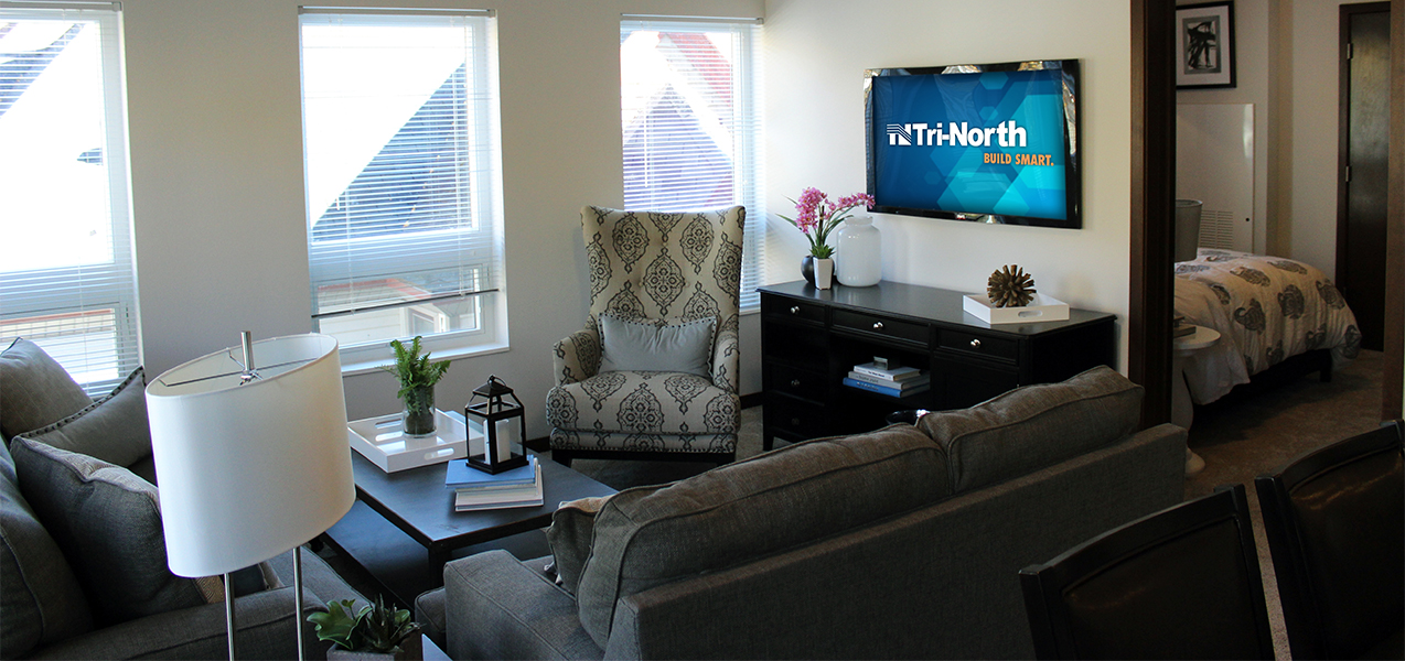 Living room area newly remodeled by Tri-North Builders inside Washington Plaza apartments.