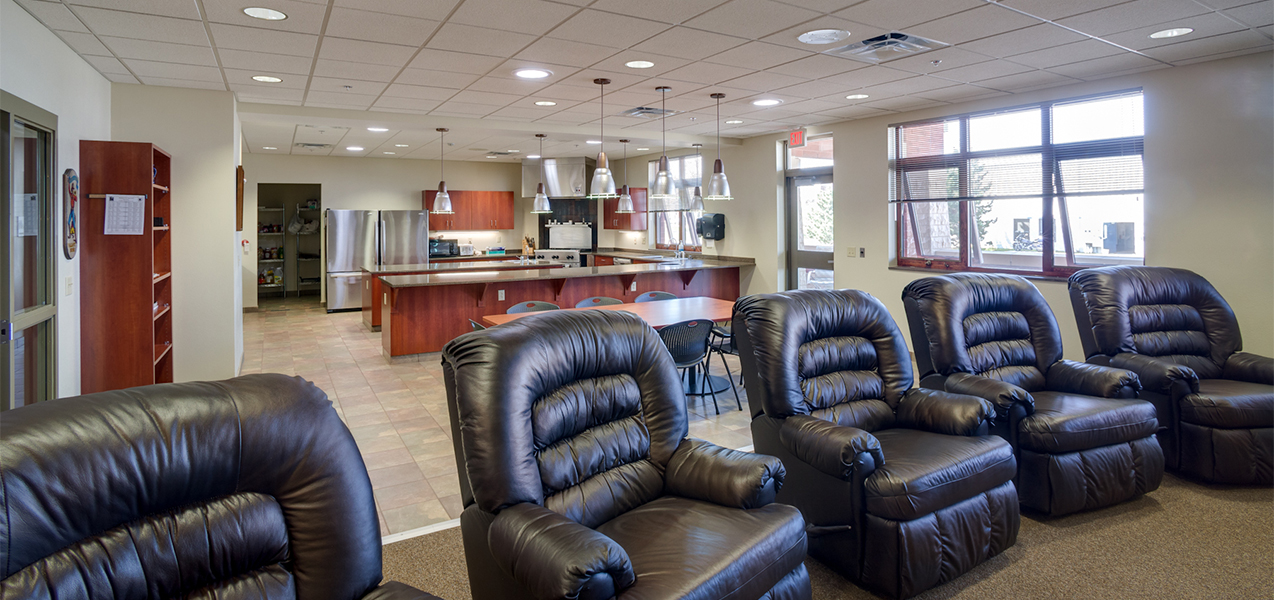 Waukesha, WI, fire department station sitting area with leather easy chairs and windows.