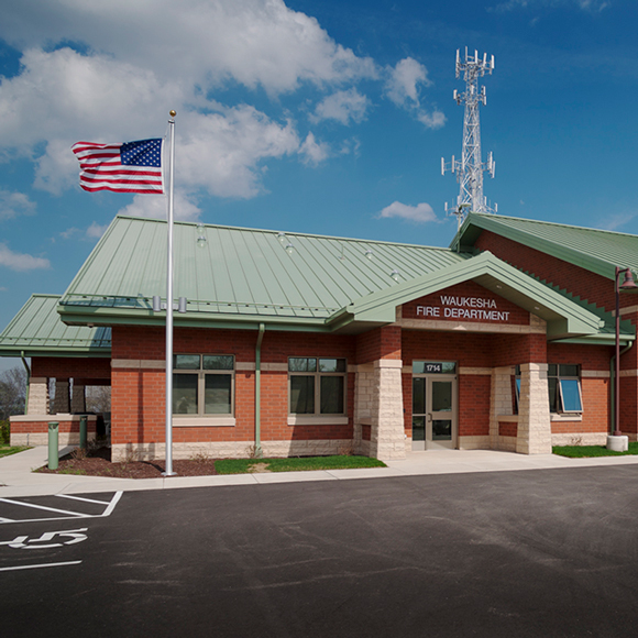Waukesha, WI, fire department fire station front door and flagpole. Tri-North Builders remodeled this project.