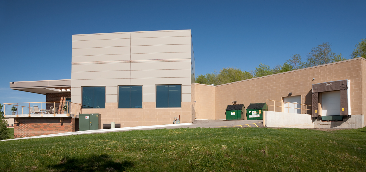 A refuse area, garage and loading dock are tucked around the back of the PIKE Technologies building in Fitchburg, WI.